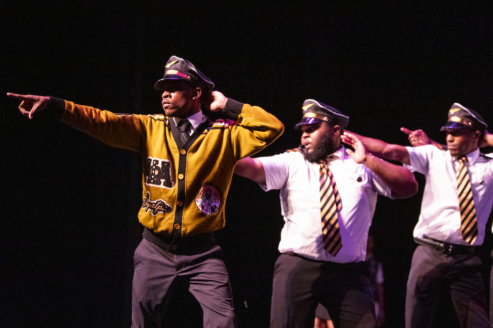 Florida Invitational Step Show - Three students performing on stage