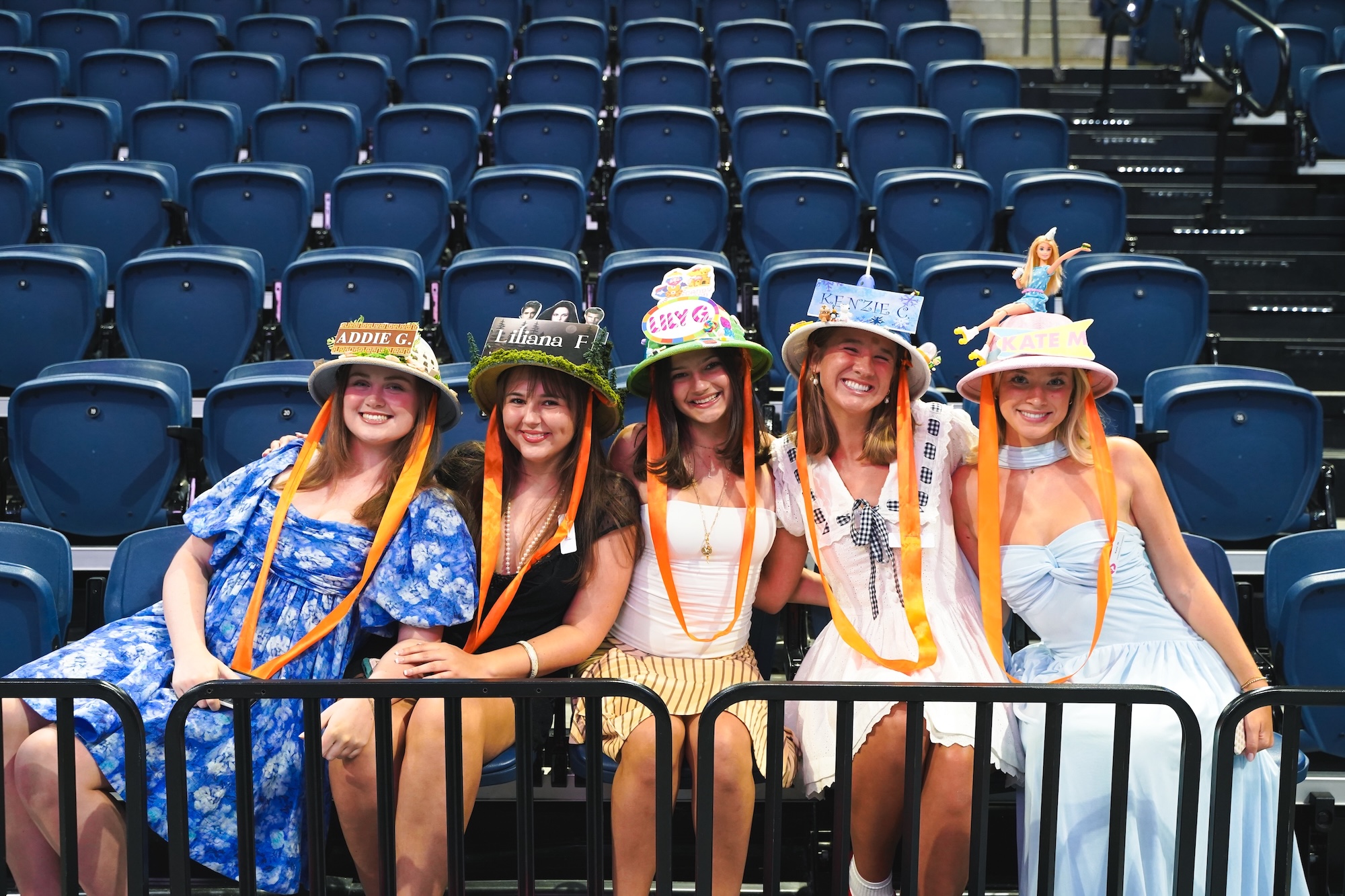 Sorority sisters wearing their themed hats and smiling for the camera on bid day.